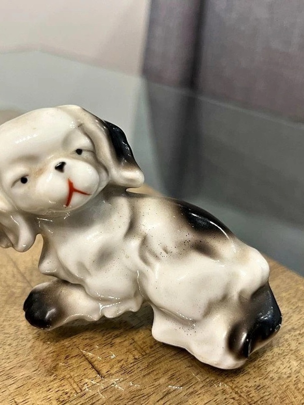 vintage white and black ceramic or porcelain figurine a Pekingnese or spaniel